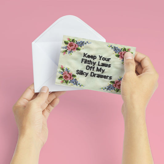 Greeting card and envelope with floral cross-stitch reading: Keep Your Filthy Laws Off My Silky Drawers. By Deb Almond Art.