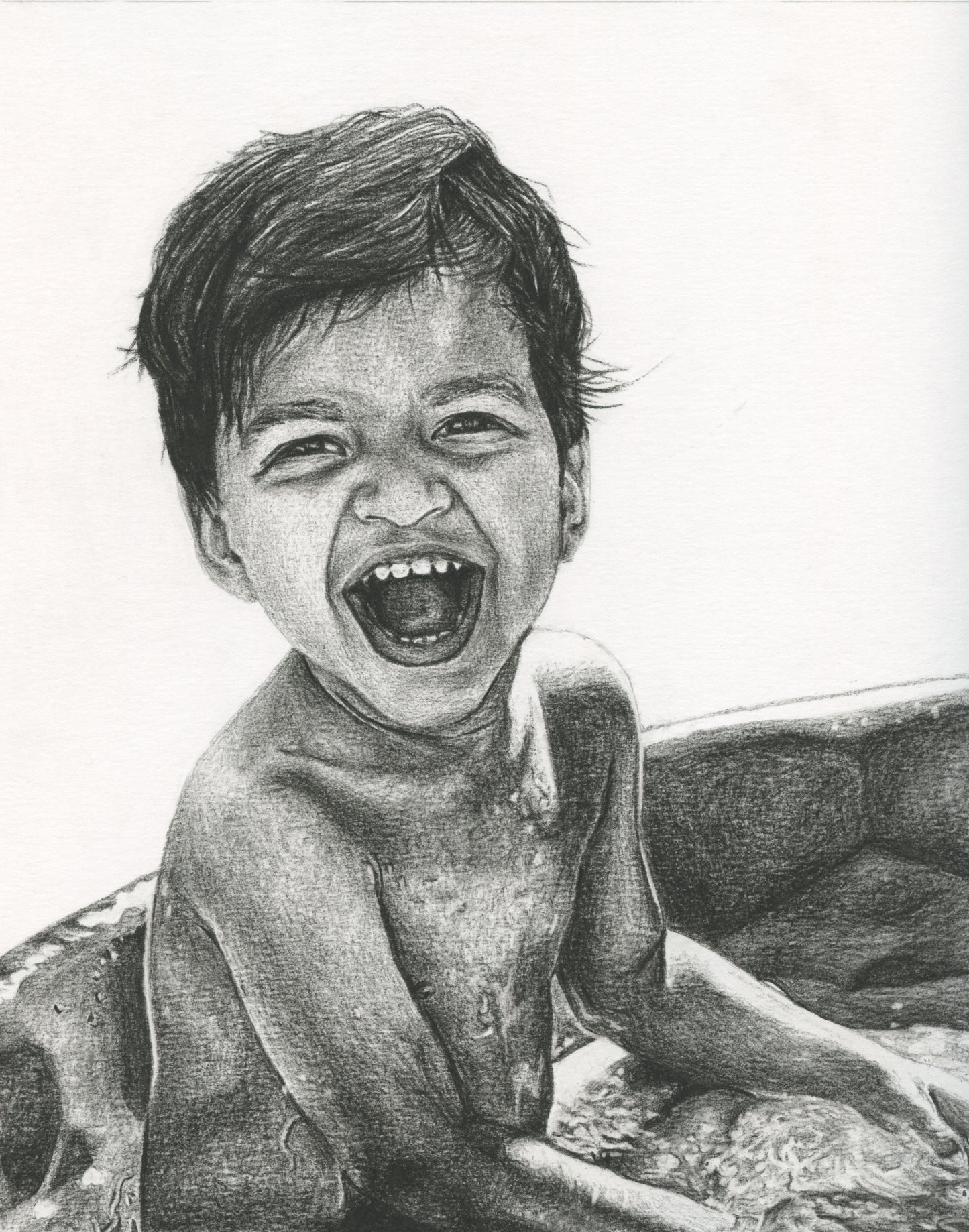 Portrait of a young boy playing in a swimming pool