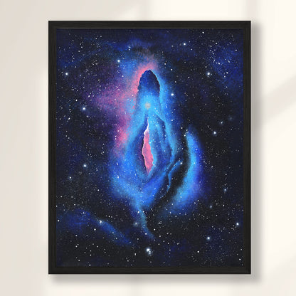 Galaxy themed vulva painting in black frame hanging on wall.