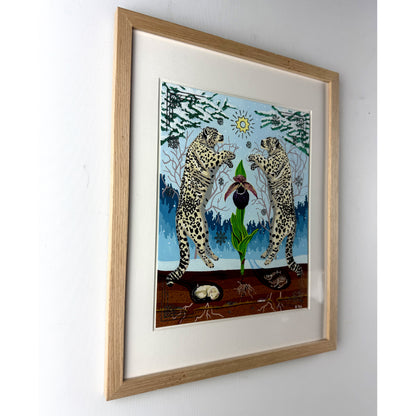 Angled side-view of the light oak wood framed snow leopard and orchid artwork mounted on a plain white wall, showcasing the frame's profile and depth.